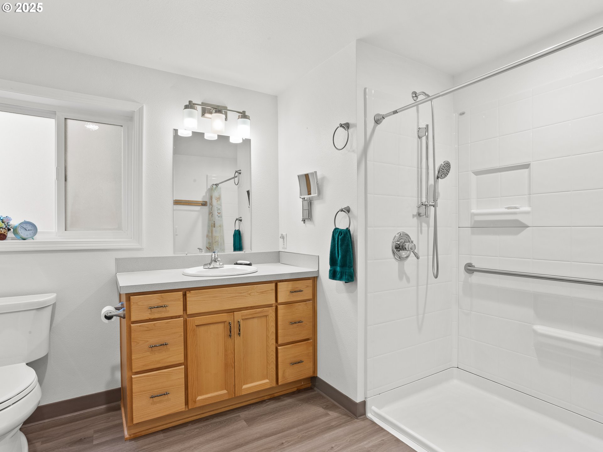 34603 Southeast Jarl Road Boring, OR 97009 - Photo 31 of 48 a bathroom with a granite countertop sink a toilet a mirror and shower