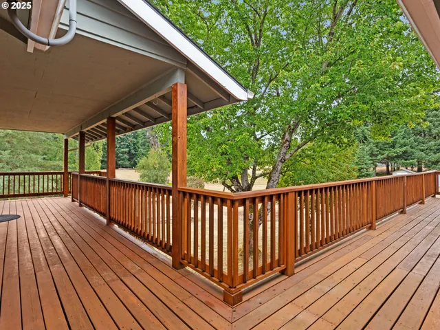 a view of balcony with wooden floor