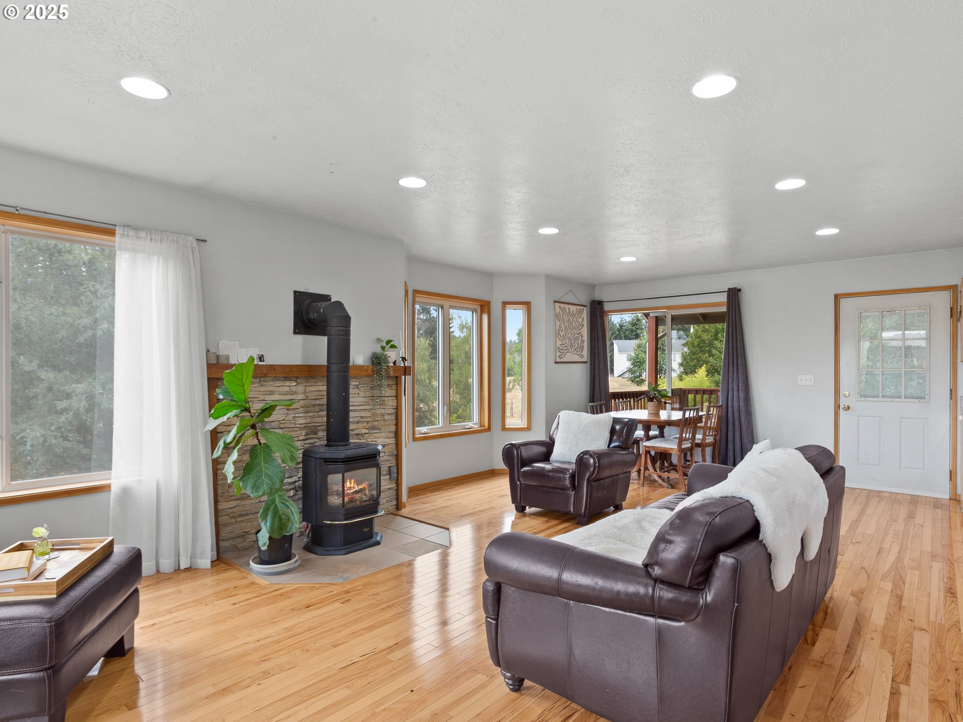 34603 Southeast Jarl Road Boring, OR 97009 - Photo 35 of 48 a living room with furniture a fireplace and a potted plant