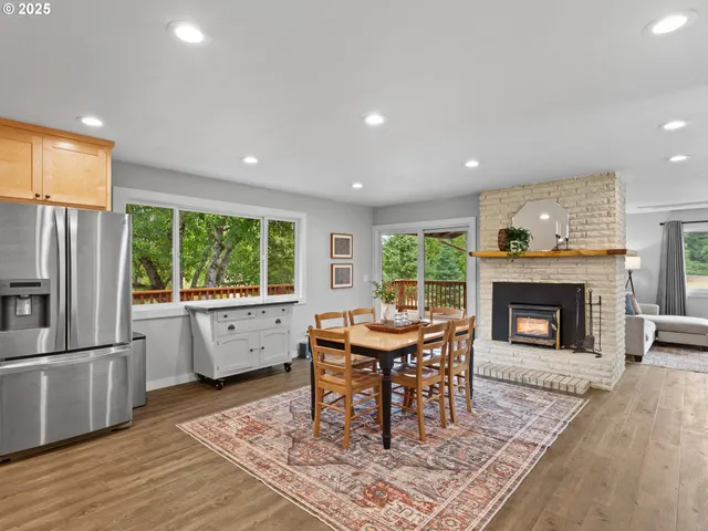 a living room with a fireplace and a table
