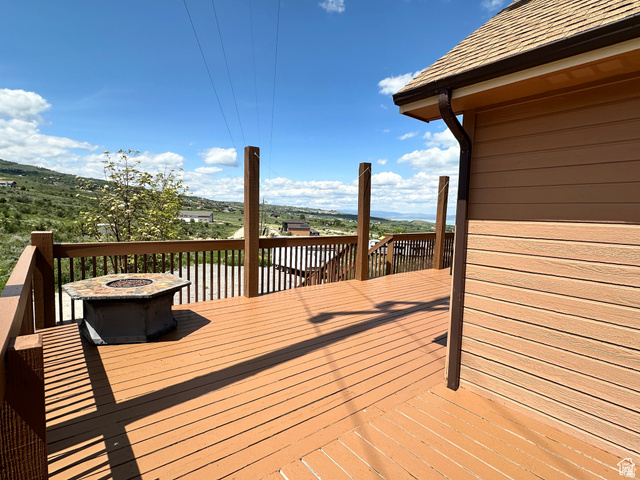 12 Crook Street Fish Haven, ID 83287 - Photo 10 of 35 Wooden terrace with an outdoor fire pit