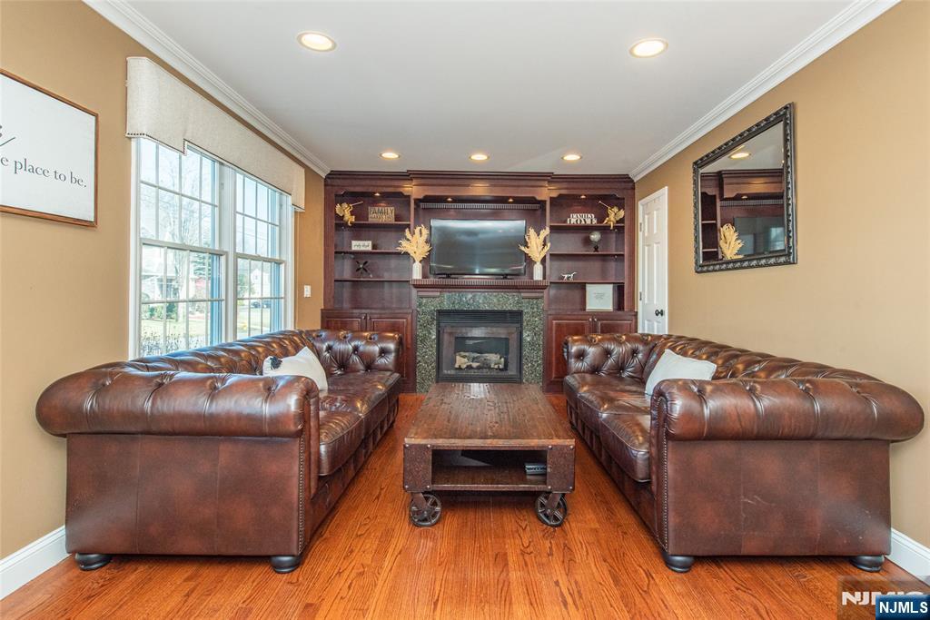 18 Stonycroft Road Wayne, NJ 07470 - Photo 12 of 40 a living room with furniture and a fireplace