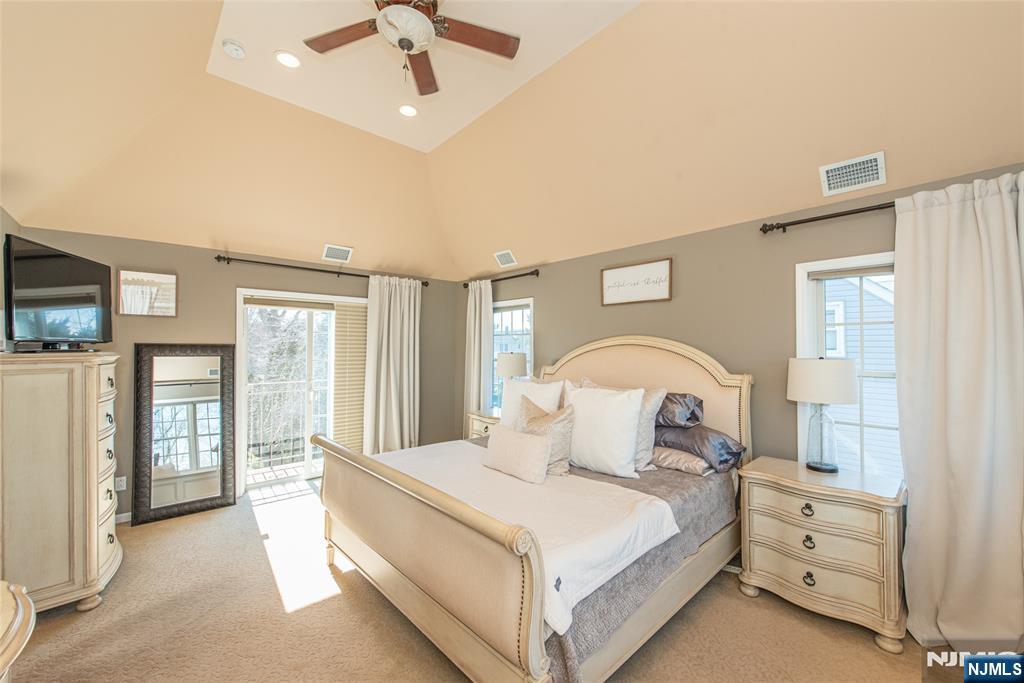 18 Stonycroft Road Wayne, NJ 07470 - Photo 17 of 40 a bedroom with a large bed and a tv