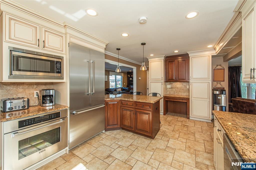 18 Stonycroft Road Wayne, NJ 07470 - Photo 6 of 40 a kitchen with stainless steel appliances granite countertop a refrigerator and a stove top oven