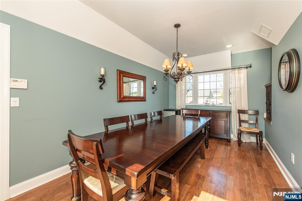 18 Stonycroft Road Wayne, NJ 07470 - Photo 9 of 40 a dining room with furniture a chandelier and wooden floor