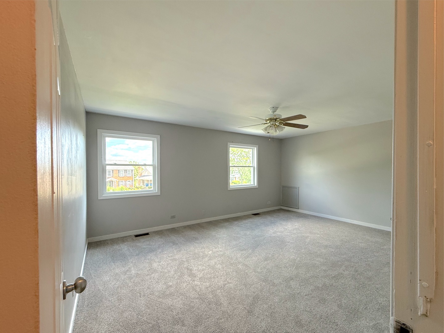 3542 Ronald Road Crete, IL 60417 - Photo 18 of 22 an empty room with windows and ceiling fan