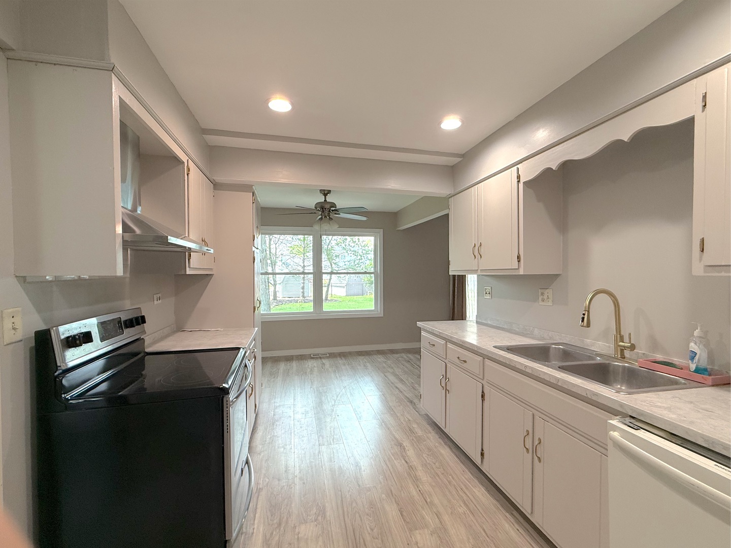 3542 Ronald Road Crete, IL 60417 - Photo 4 of 22 a kitchen with a sink stove and refrigerator