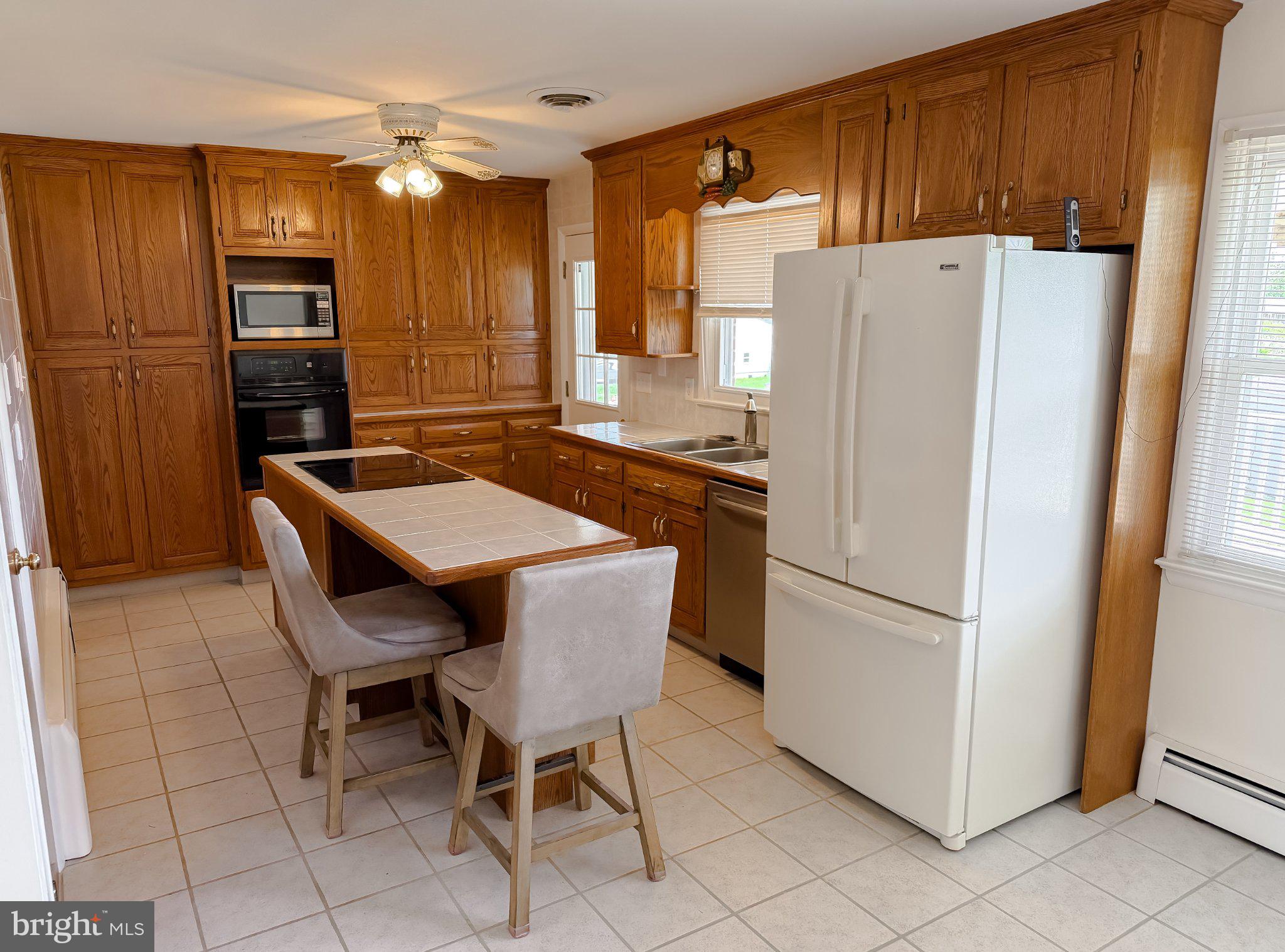 23230 Colton Point Road Avenue, MD 20609 - Photo 14 of 63 Warm wood tones in a cozy kitchen.