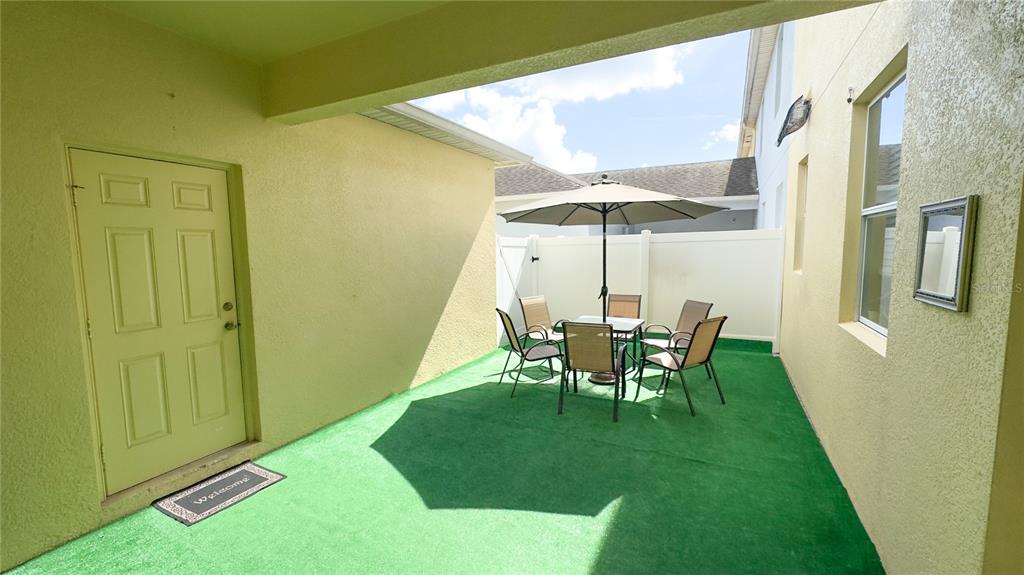 1217 Seburn Road Apopka, FL 32703 - Photo 17 of 61 a view of two chairs in the backyard