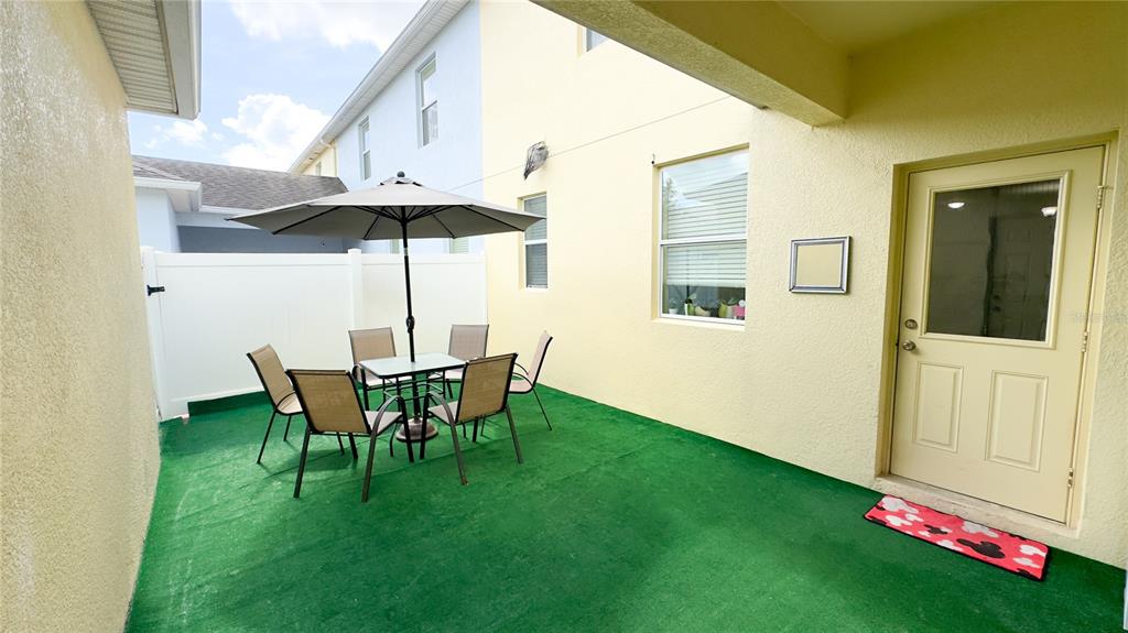 1217 Seburn Road Apopka, FL 32703 - Photo 18 of 61 a view of an house with backyard space and porch