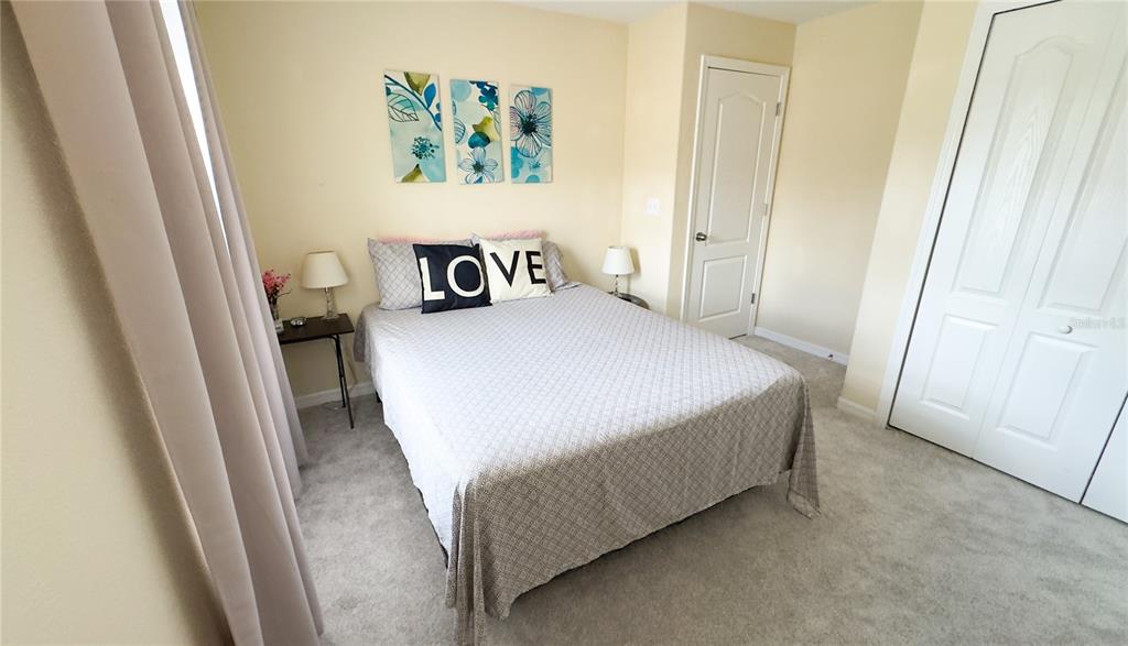 1217 Seburn Road Apopka, FL 32703 - Photo 27 of 61 a bedroom with a bed and a window