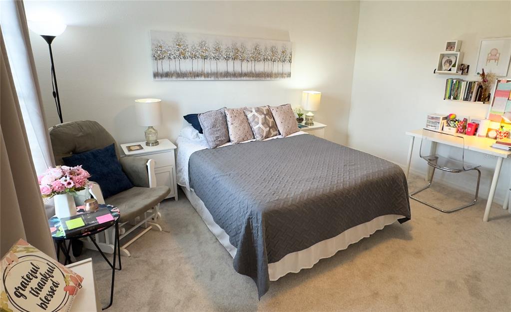 1217 Seburn Road Apopka, FL 32703 - Photo 29 of 61 a bedroom with a bed and cabinets