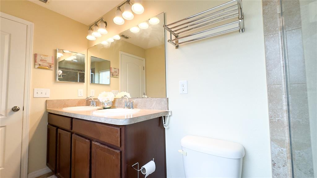 1217 Seburn Road Apopka, FL 32703 - Photo 31 of 61 a bathroom with a sink and a toilet