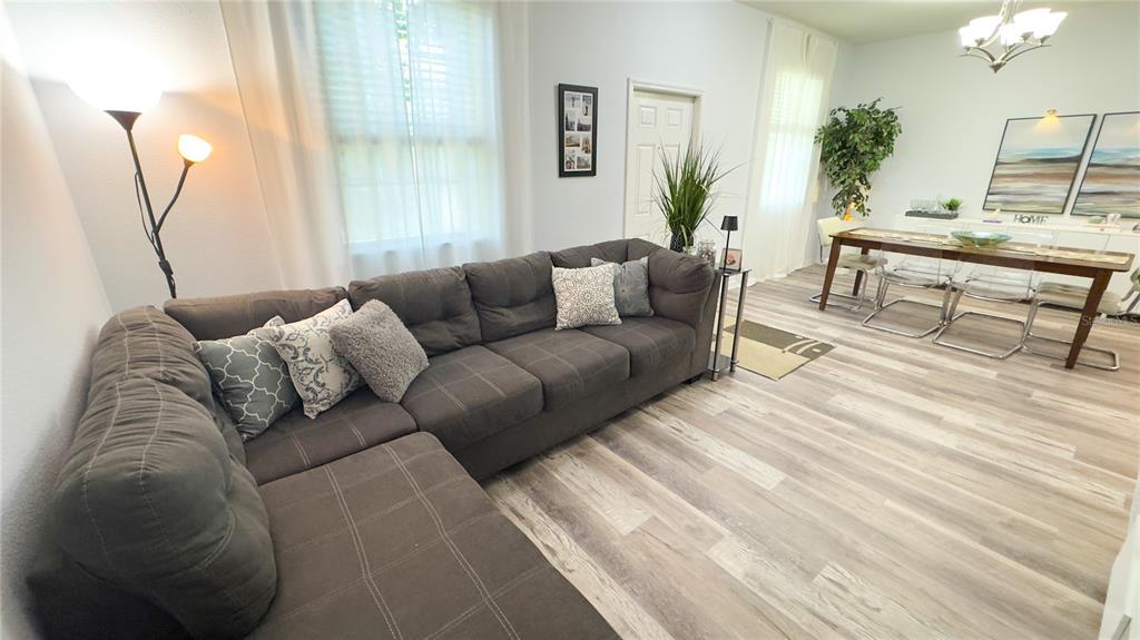 1217 Seburn Road Apopka, FL 32703 - Photo 35 of 61 a living room with furniture and a potted plant