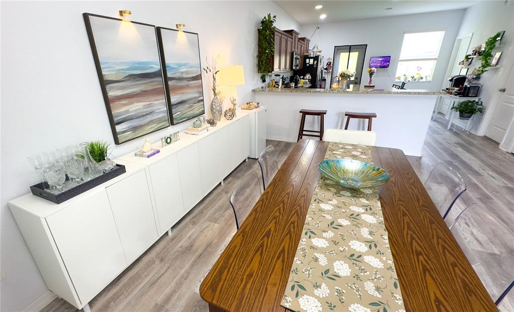 1217 Seburn Road Apopka, FL 32703 - Photo 39 of 61 a living room with furniture and a wooden floor