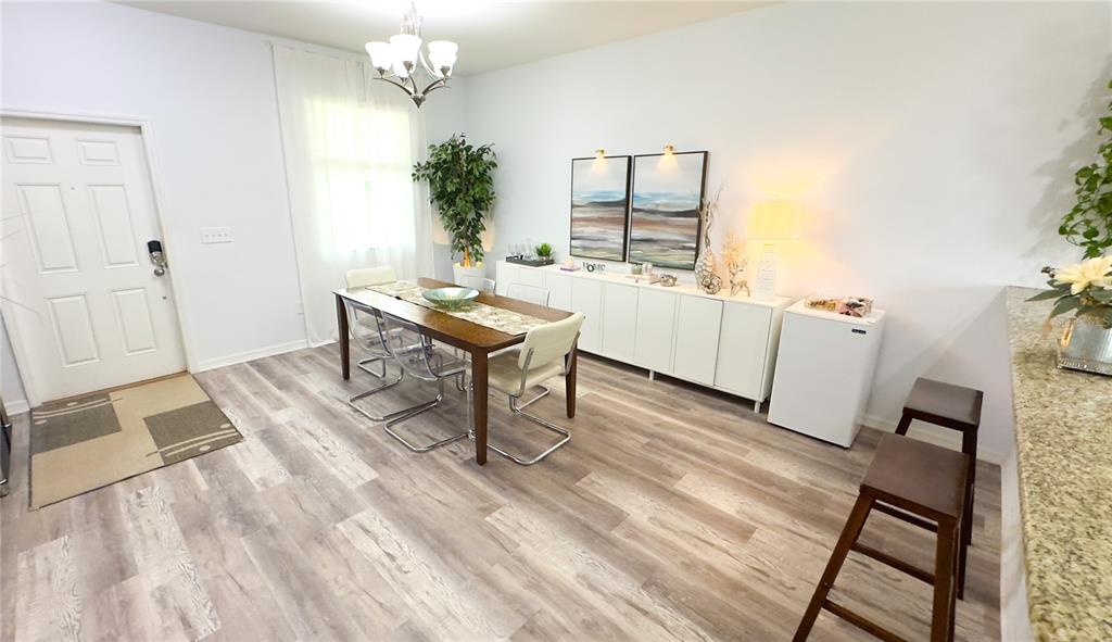 1217 Seburn Road Apopka, FL 32703 - Photo 40 of 61 a living room with furniture and a table