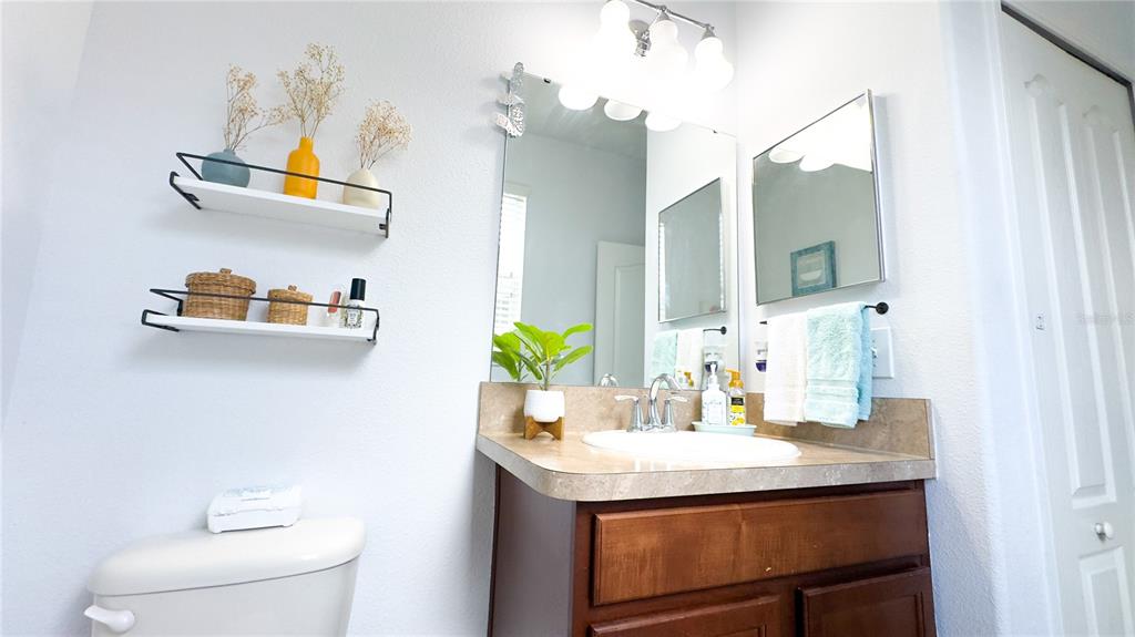 1217 Seburn Road Apopka, FL 32703 - Photo 45 of 61 a bathroom with a sink and a mirror