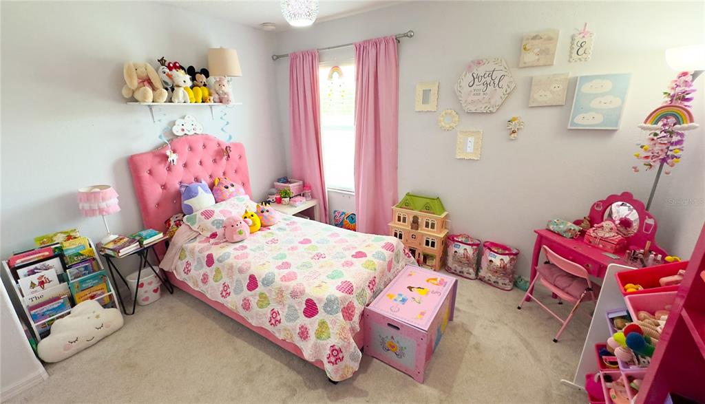 1217 Seburn Road Apopka, FL 32703 - Photo 47 of 61 a bedroom with a bed and toys