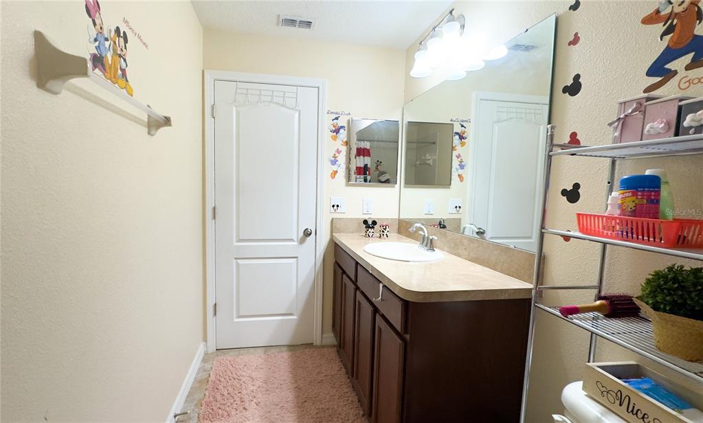 1217 Seburn Road Apopka, FL 32703 - Photo 51 of 61 a bathroom with a sink and a mirror