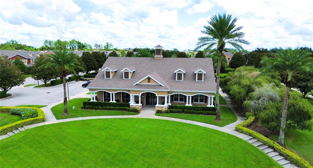 1217 Seburn Road Apopka, FL 32703 - Photo 59 of 61 a view of a white house with a big yard and large trees