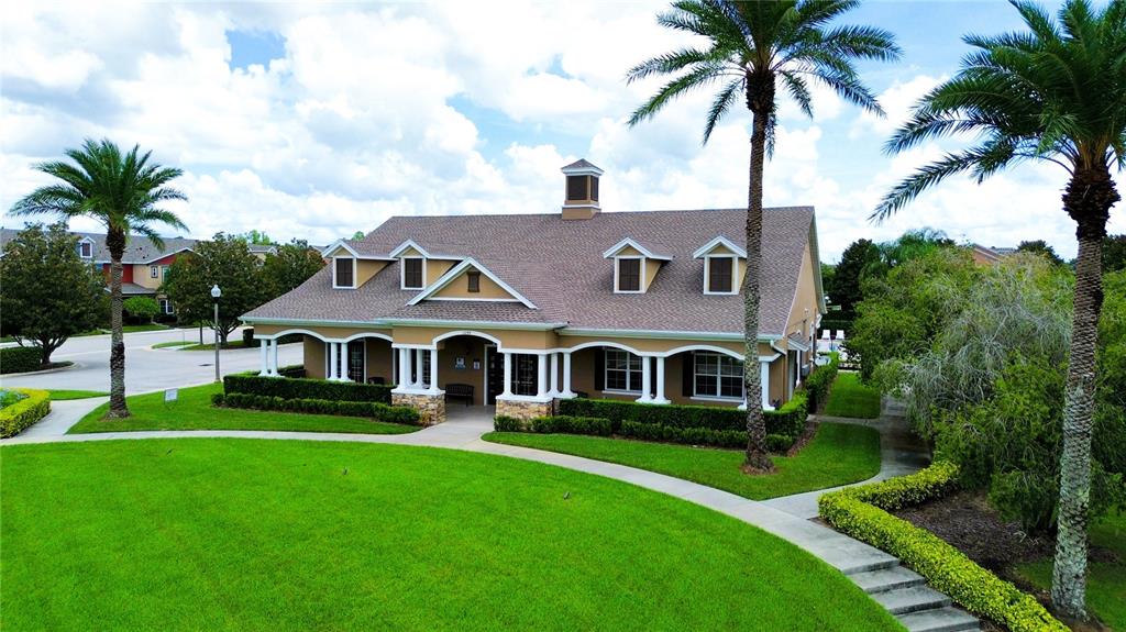 1217 Seburn Road Apopka, FL 32703 - Photo 60 of 61 a front view of a house with a garden and lake view