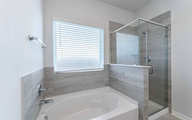 a bath tub sitting next to a window