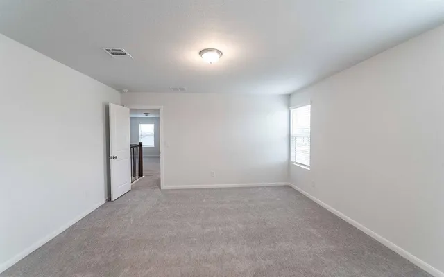 a view of an empty room and window