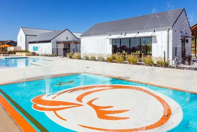 a view of a swimming pool with an outdoor seating