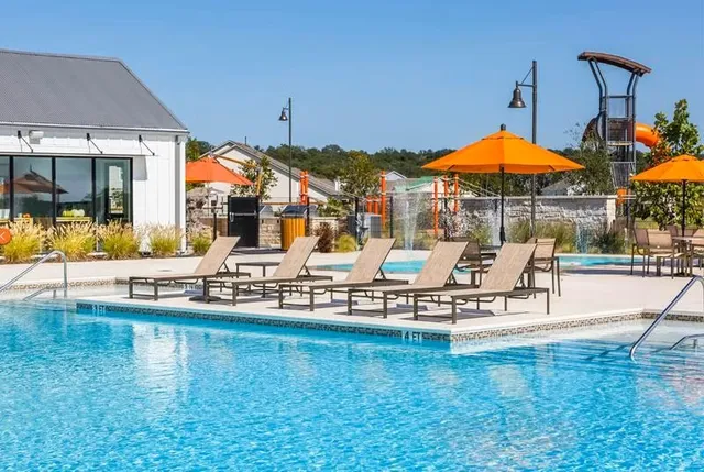 an outdoor space with patio and swimming pool