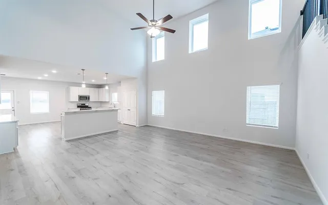 a view of a kitchen with a sink and a window