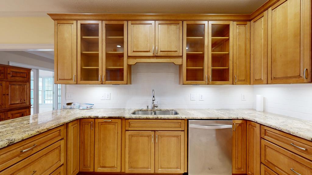 4608 Baltusrol Court Columbus, GA 31909 - Photo 16 of 76 a kitchen with stainless steel appliances granite countertop a sink and cabinets