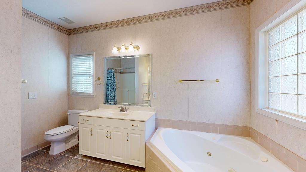4608 Baltusrol Court Columbus, GA 31909 - Photo 27 of 76 a bathroom with a sink a toilet and shower