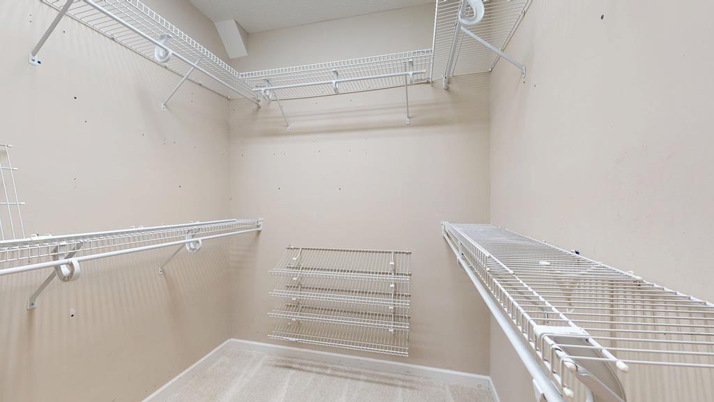 4608 Baltusrol Court Columbus, GA 31909 - Photo 33 of 76 a view of walk in closet with empty racks