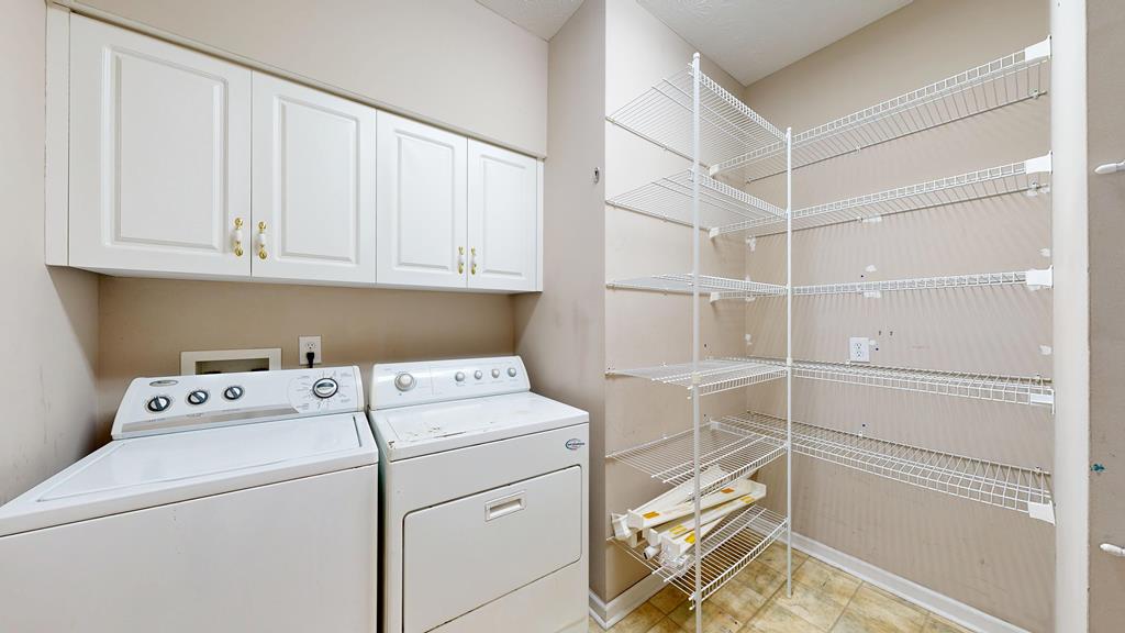 4608 Baltusrol Court Columbus, GA 31909 - Photo 37 of 76 a view of storage and utility room with washer and dryer