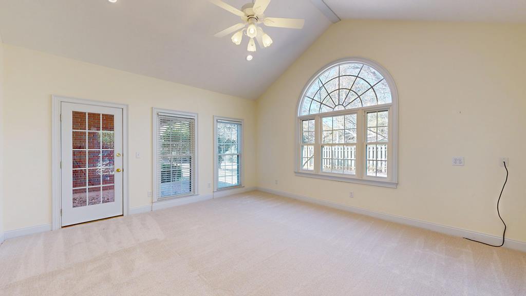 4608 Baltusrol Court Columbus, GA 31909 - Photo 43 of 76 an empty room with windows closet and chandelier fan