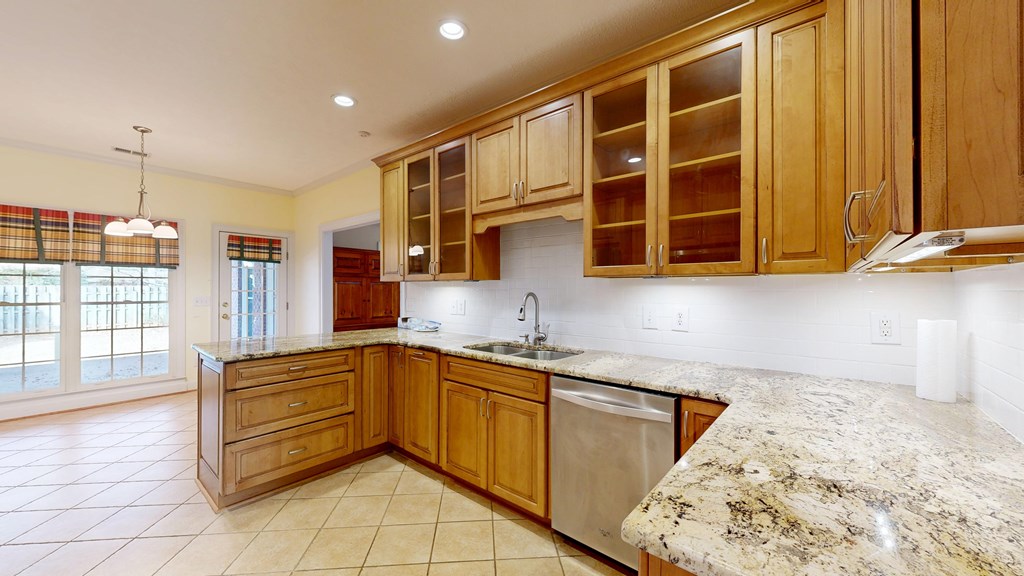 4608 Baltusrol Court Columbus, GA 31909 - Photo 5 of 76 a kitchen with granite countertop a sink and cabinets
