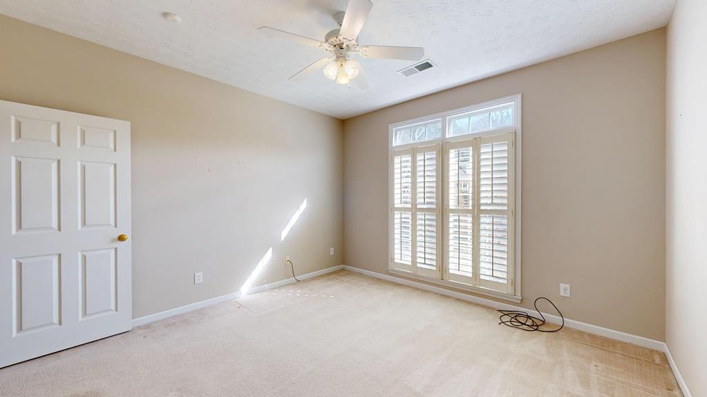 4608 Baltusrol Court Columbus, GA 31909 - Photo 51 of 76 an empty room with windows and fan
