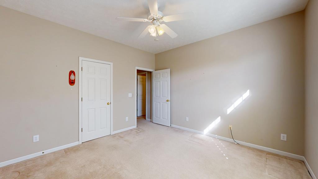 4608 Baltusrol Court Columbus, GA 31909 - Photo 52 of 76 an empty room with a ceiling fan and a window