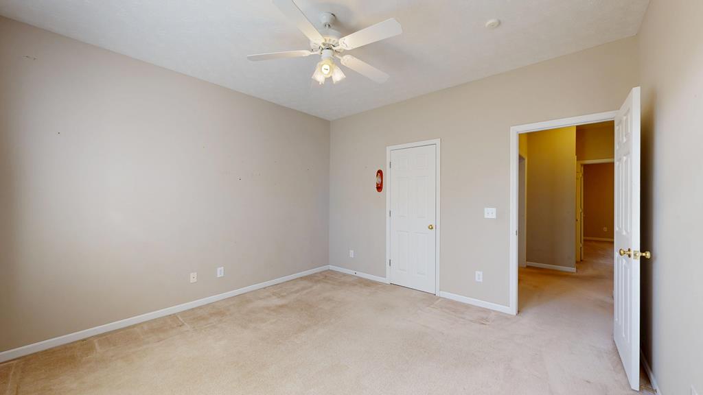 4608 Baltusrol Court Columbus, GA 31909 - Photo 53 of 76 an empty room with a ceiling fan and a window