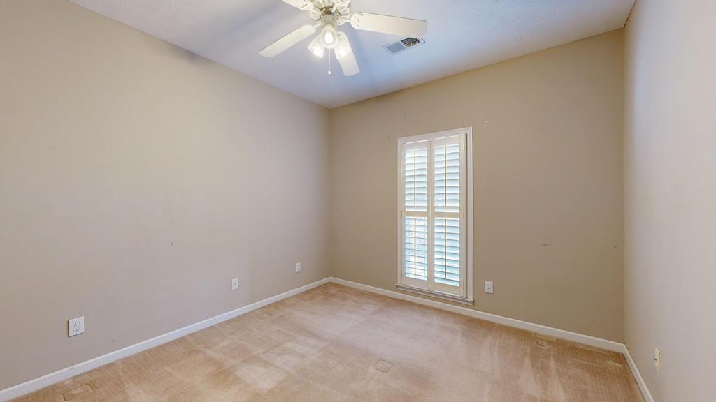 4608 Baltusrol Court Columbus, GA 31909 - Photo 54 of 76 an empty room with a window and ceiling fan