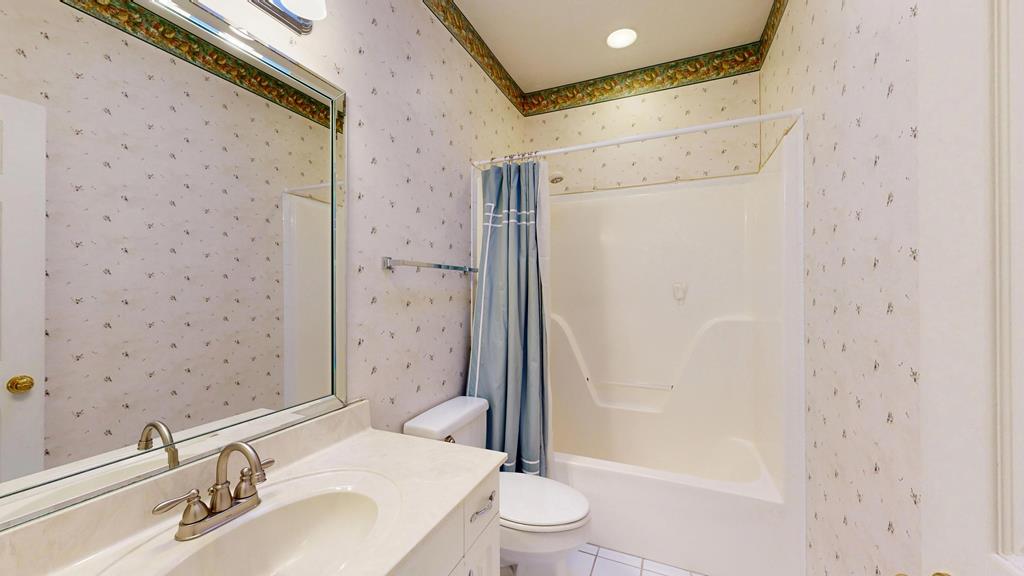 4608 Baltusrol Court Columbus, GA 31909 - Photo 58 of 76 a bathroom with a sink a toilet and shower