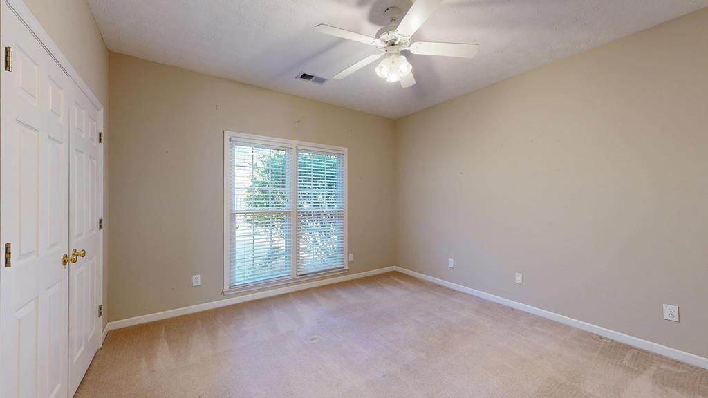 4608 Baltusrol Court Columbus, GA 31909 - Photo 61 of 76 an empty room with chandelier fan and windows