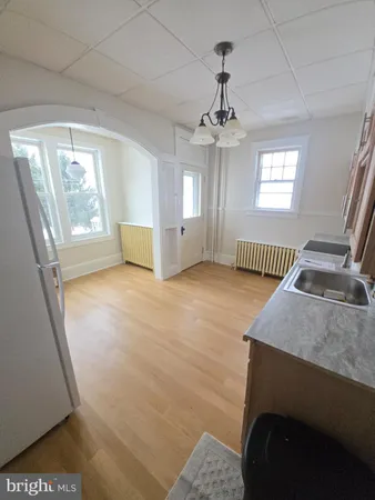 a bedroom with furniture and a chandelier