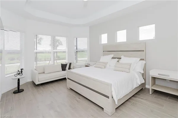 a bed room with a bed and a large white bed