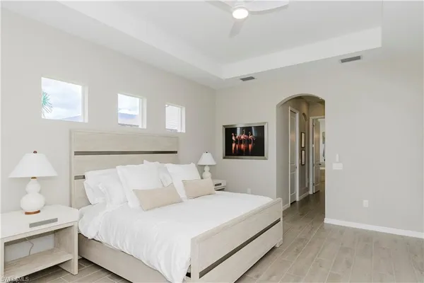 a bedroom with bed and a night stand