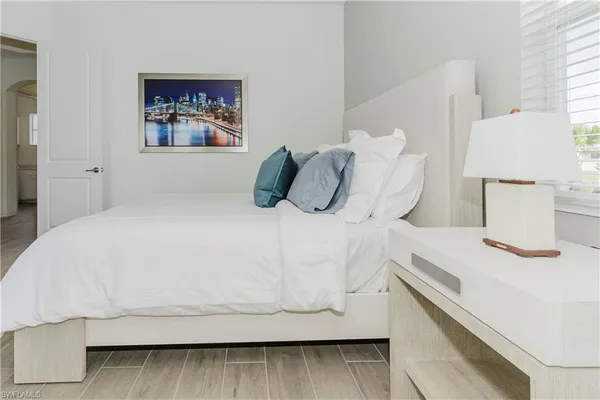 a bathroom with a sink toilet a mirror and shower