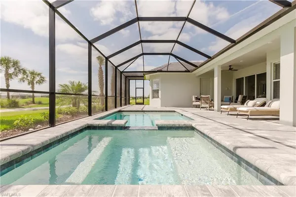 a view of a swimming pool with a lounge chairs