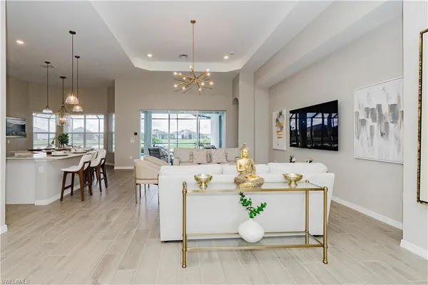 a living room with fireplace furniture and a flat screen tv