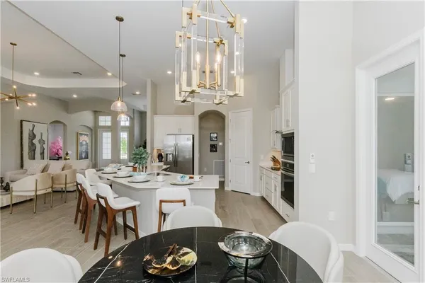 a view of a dining room with furniture and wooden floor
