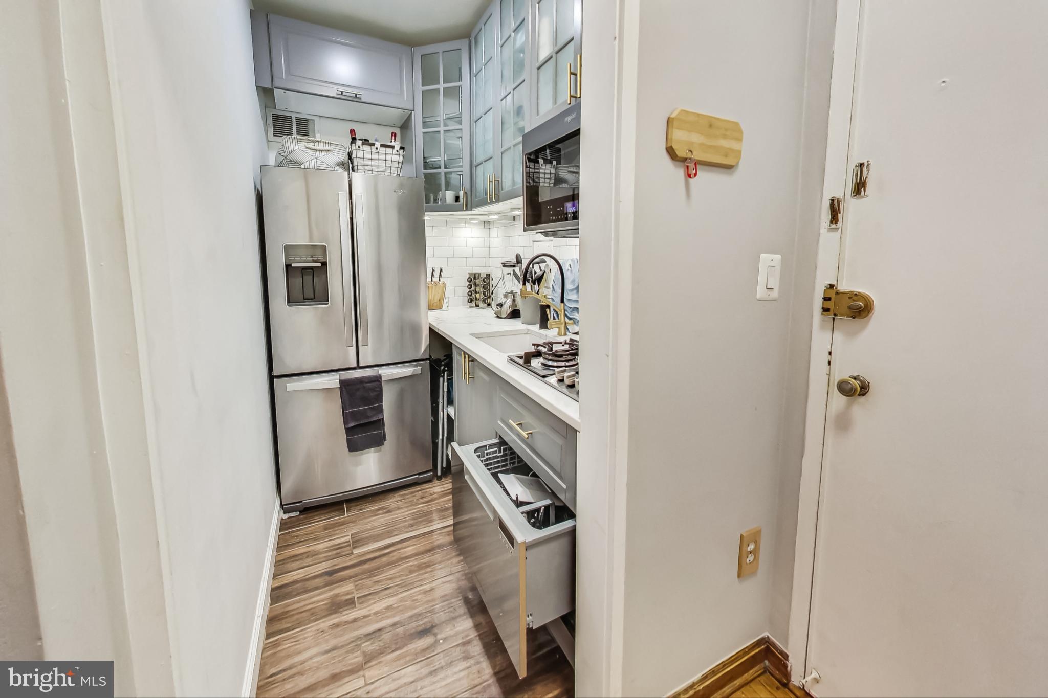 1 Scott Circle Northwest, Unit 20 Washington, DC 20005 - Photo 13 of 37 a kitchen with stainless steel appliances granite countertop a refrigerator and a stove